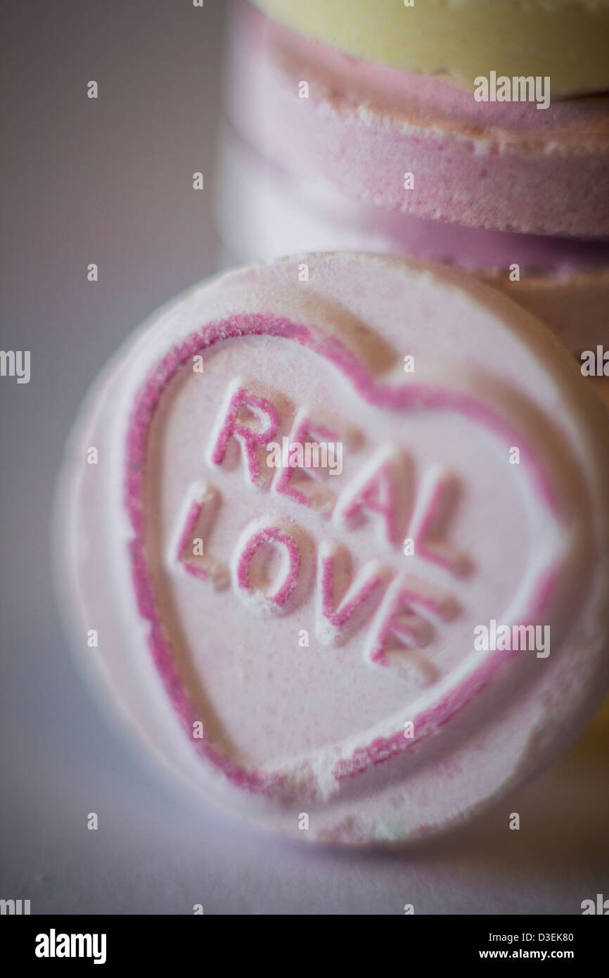 'Real Love',written on Love Heart sweets Stock Photo