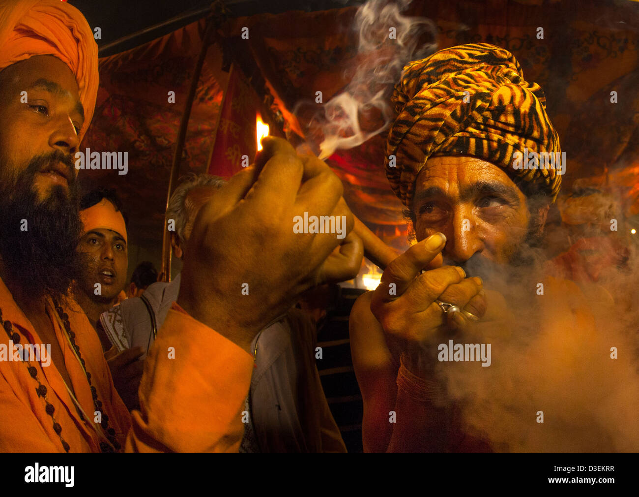 A Naga Sadhu Smoking Pot, Maha Kumbh Mela, Allahabad, India Stock Photo