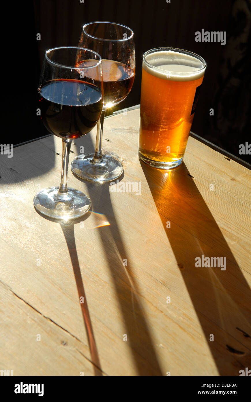 A pint of beer and two glasses of wine in a Shropshire pub, England Stock Photo