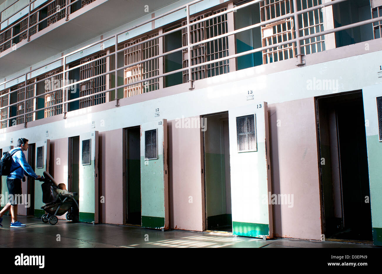 Man pushes a baby stroller into a solitary confinement cell at Alcatraz