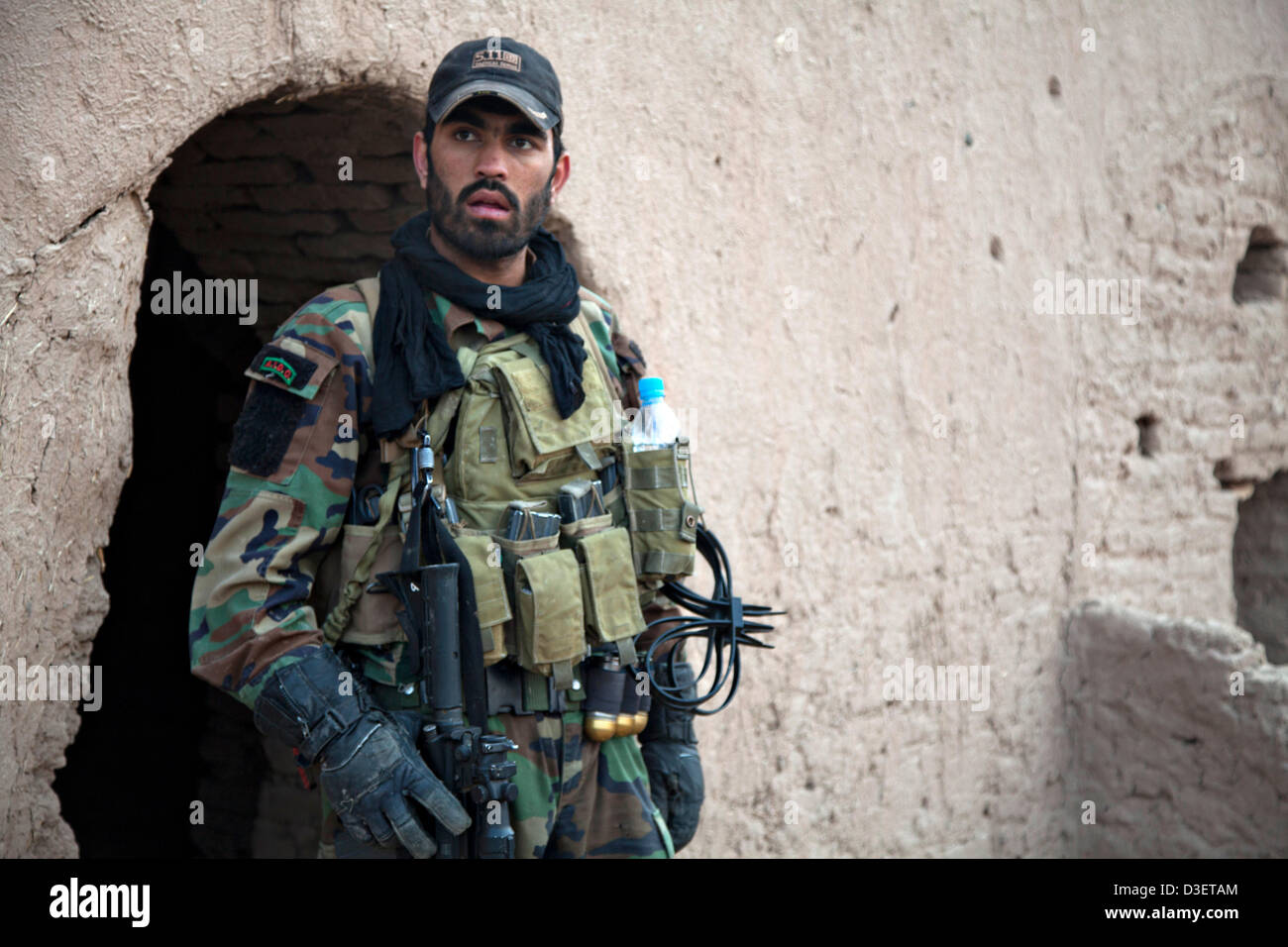 Afghan National Army Special Forces soldiers return from a combat patrol February 17, 2013 in Herat province, Afghanistan. President Barack Obama announced during the State of the Union that half the US force in Afghanistan will withdraw by early 2014. Stock Photo