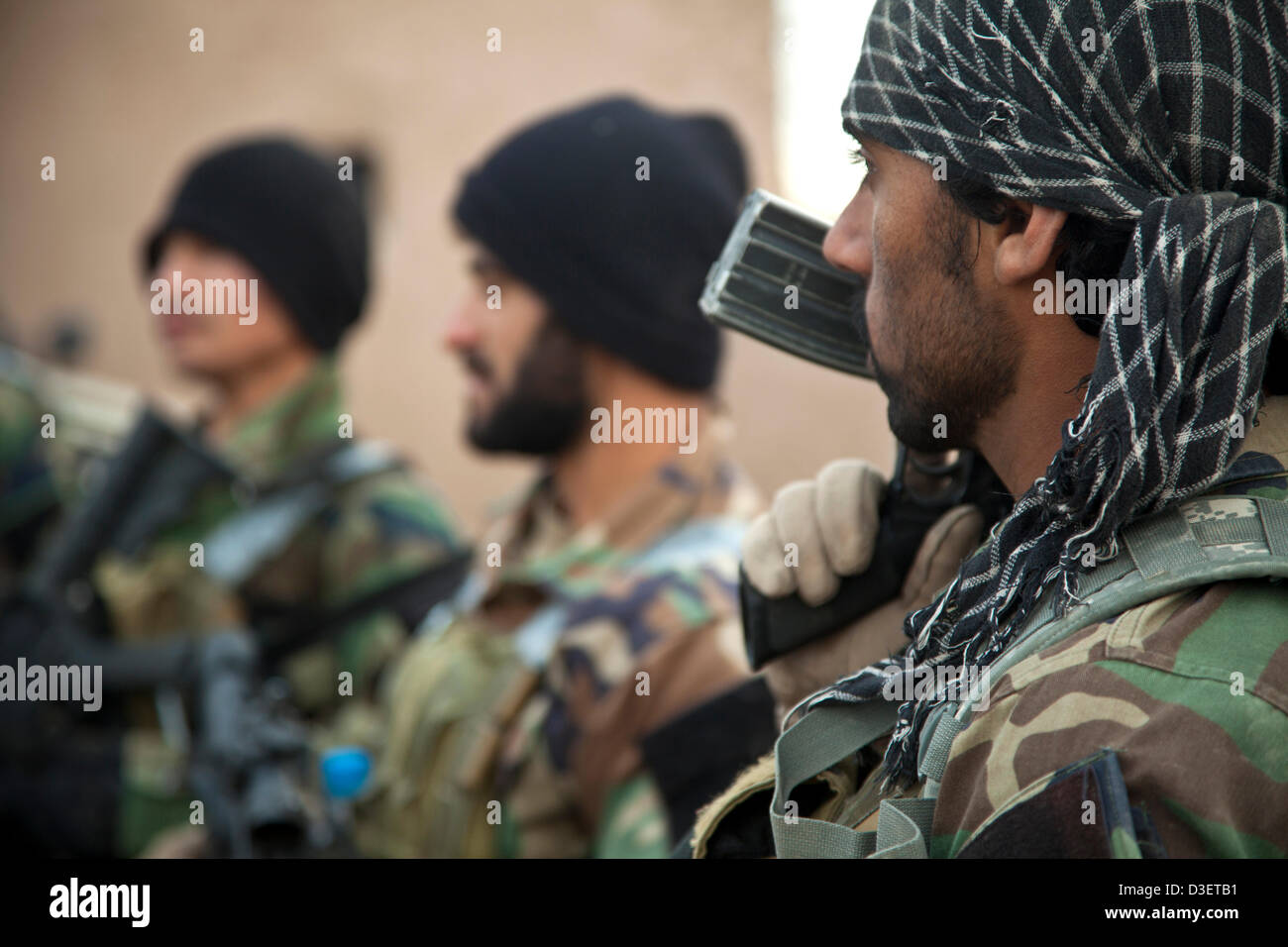 Afghan National Army Special Forces soldiers return from a combat patrol February 17, 2013 in Herat province, Afghanistan. President Barack Obama announced during the State of the Union that half the US force in Afghanistan will withdraw by early 2014. Stock Photo