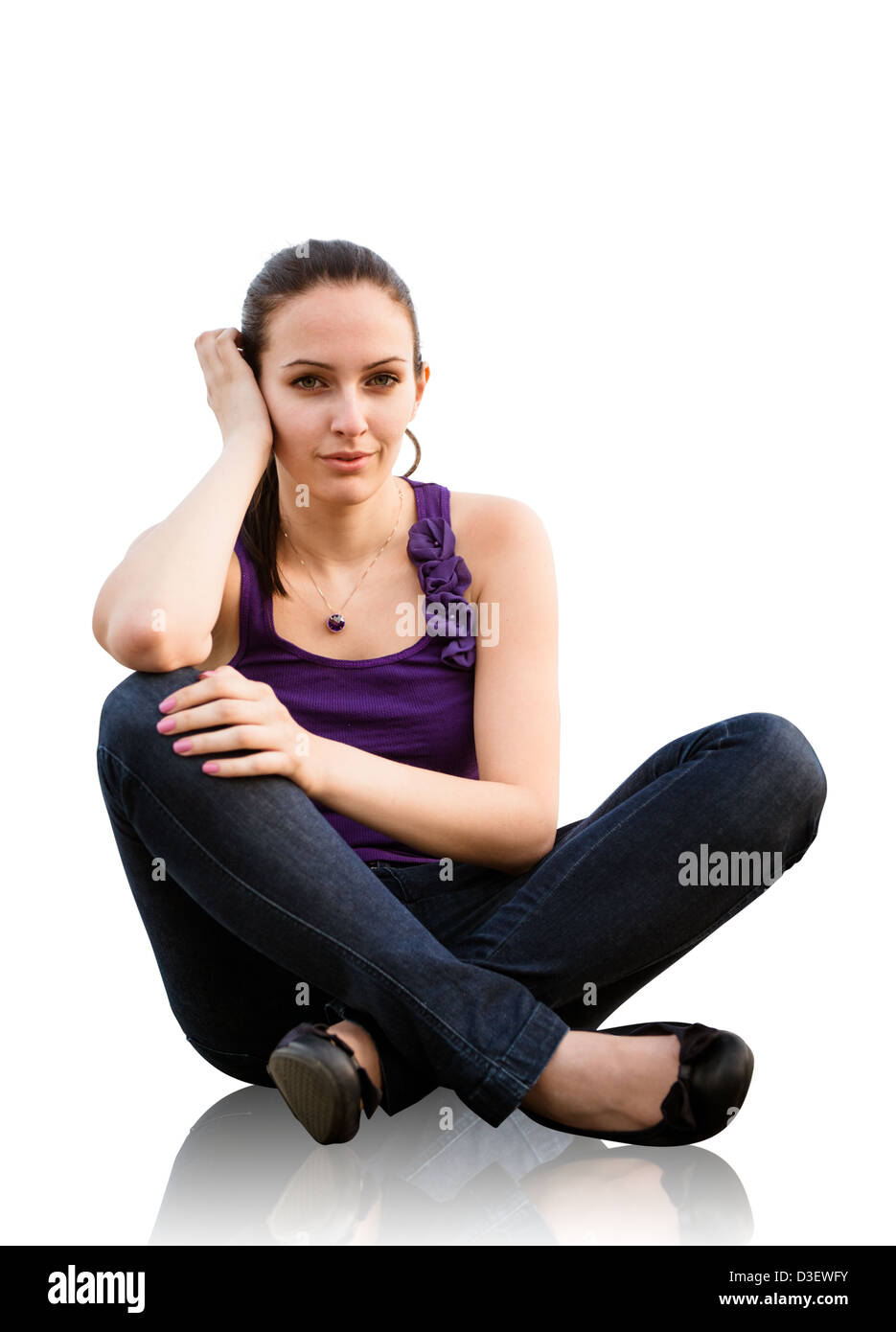 Portrait of young woman sitting on ground - isolated on white ...