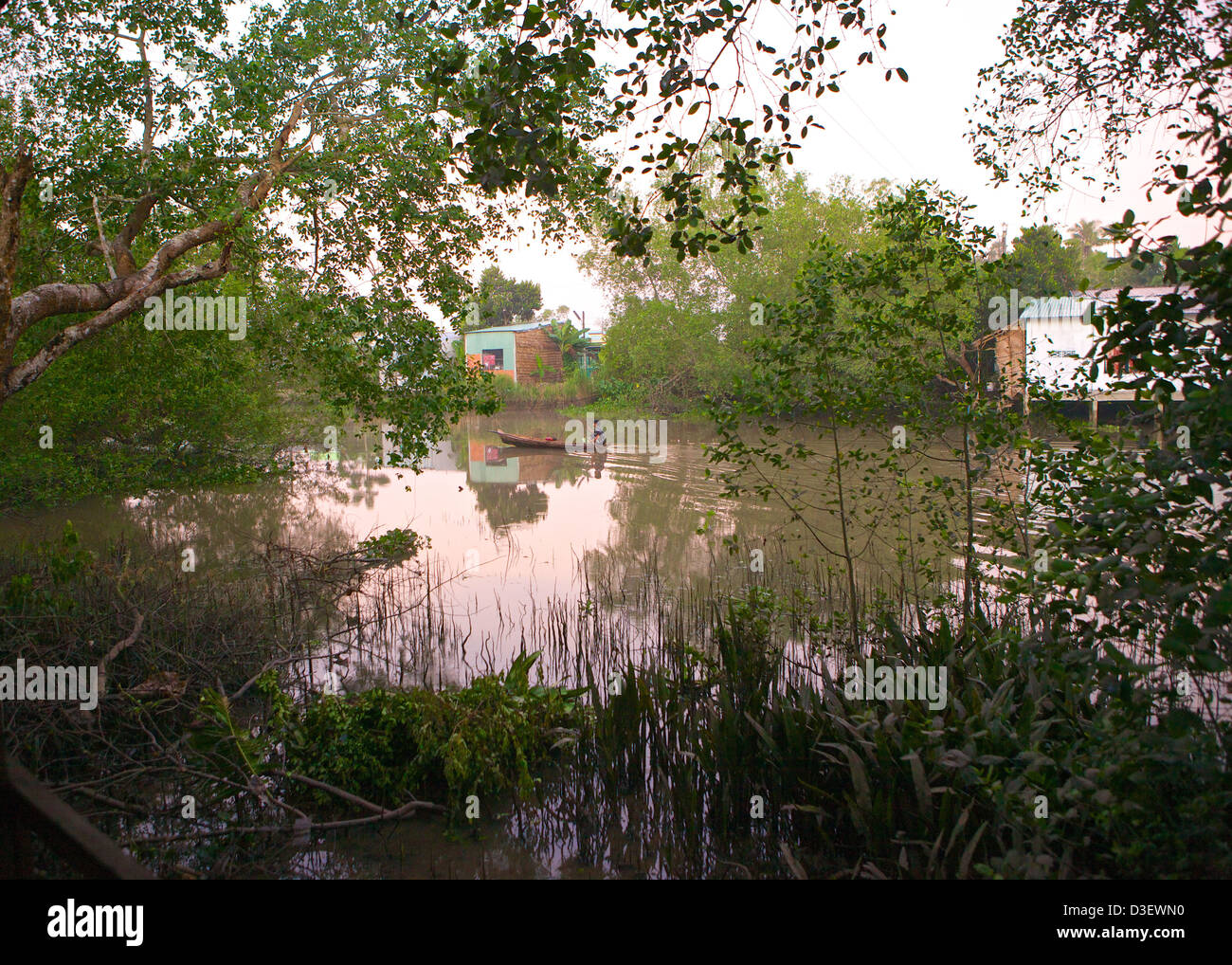 Man in a boat Can Tho area river, Mekong Delta, Vietnam Stock Photo - Alamy