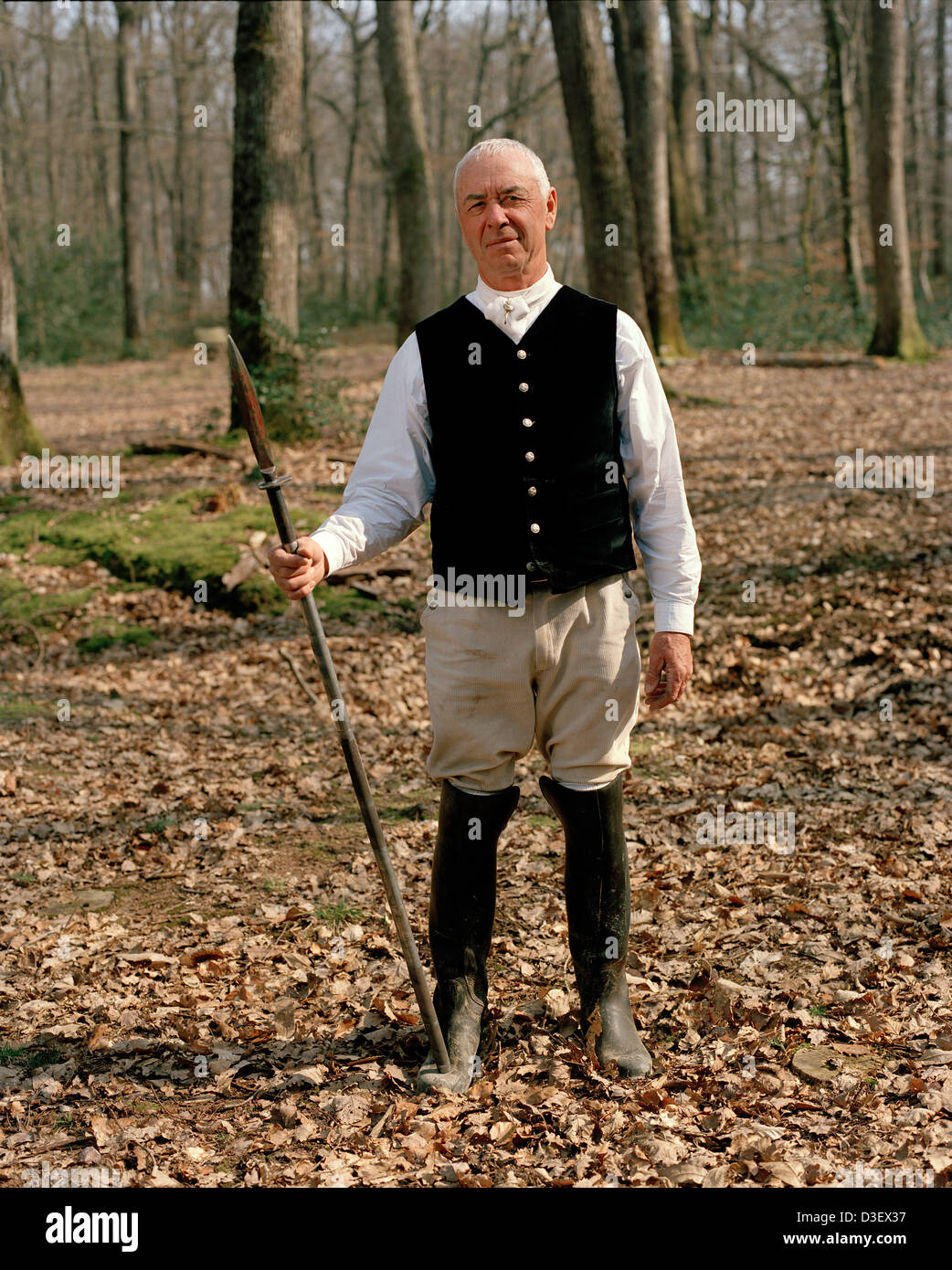 Henri Gruloos holds the lance with which he just killed the wild boar, after a one hour’s hunt. Stock Photo