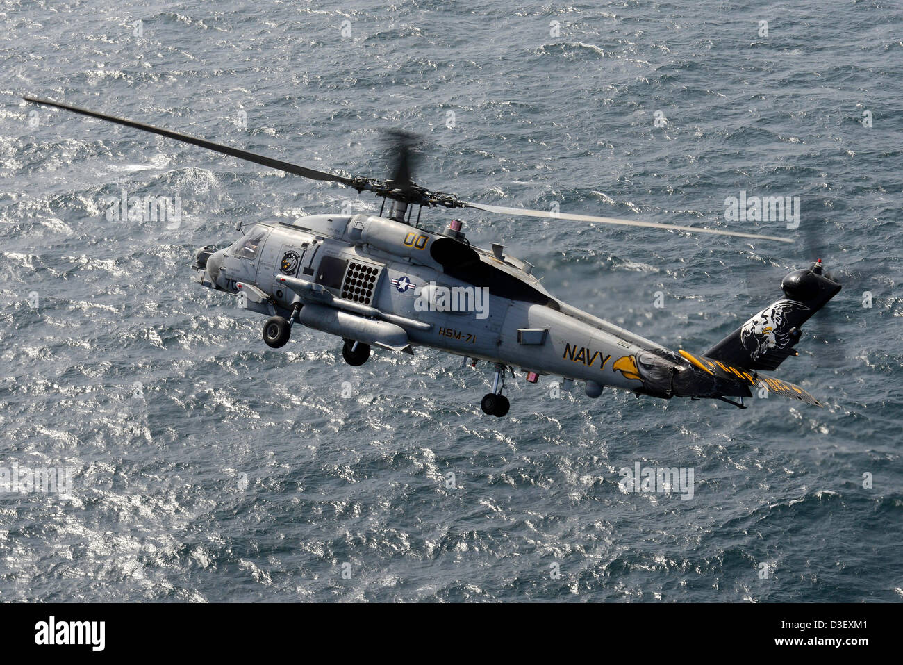 Aerial view of a US Navy MH-60R Sea Hawk helicopter February 15, 2013 on patrol in the Arabian Sea. Stock Photo