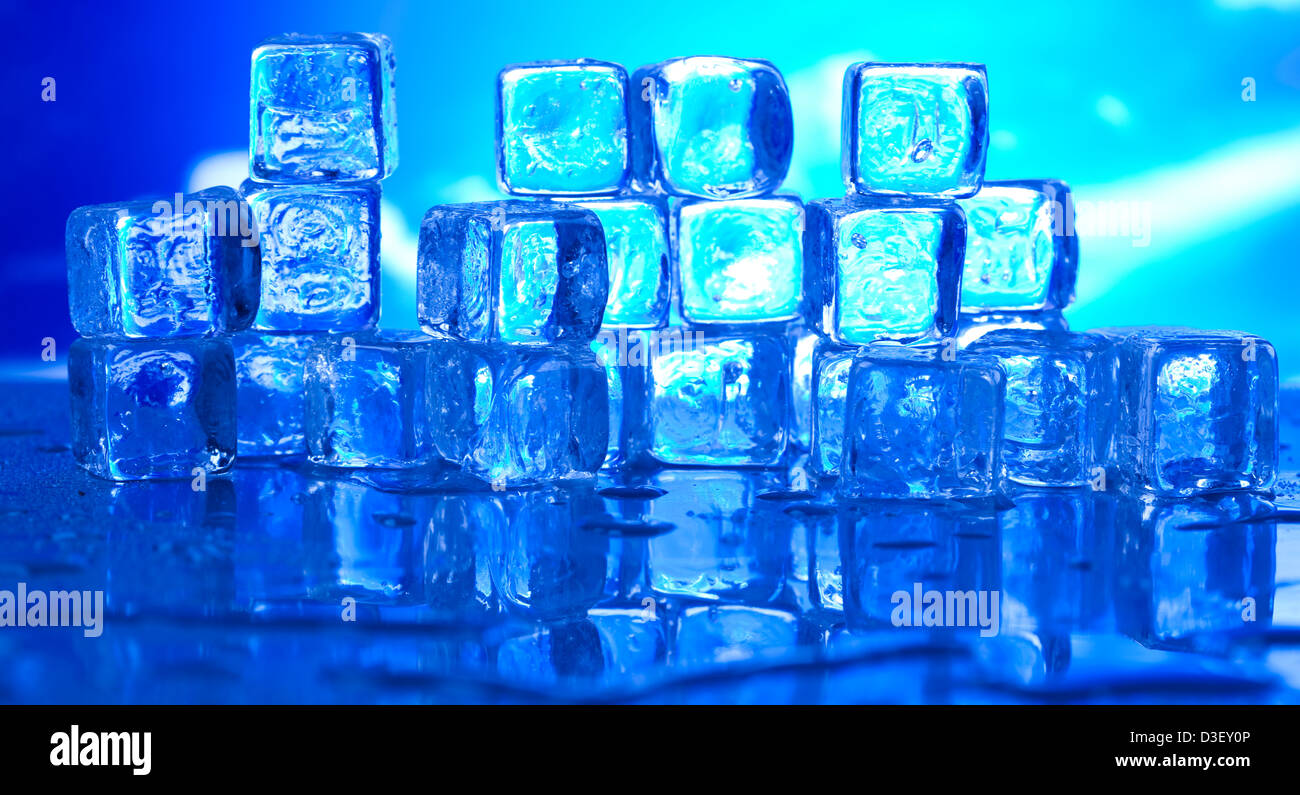 Transparent ice cubes and blue sky background Stock Photo - Alamy