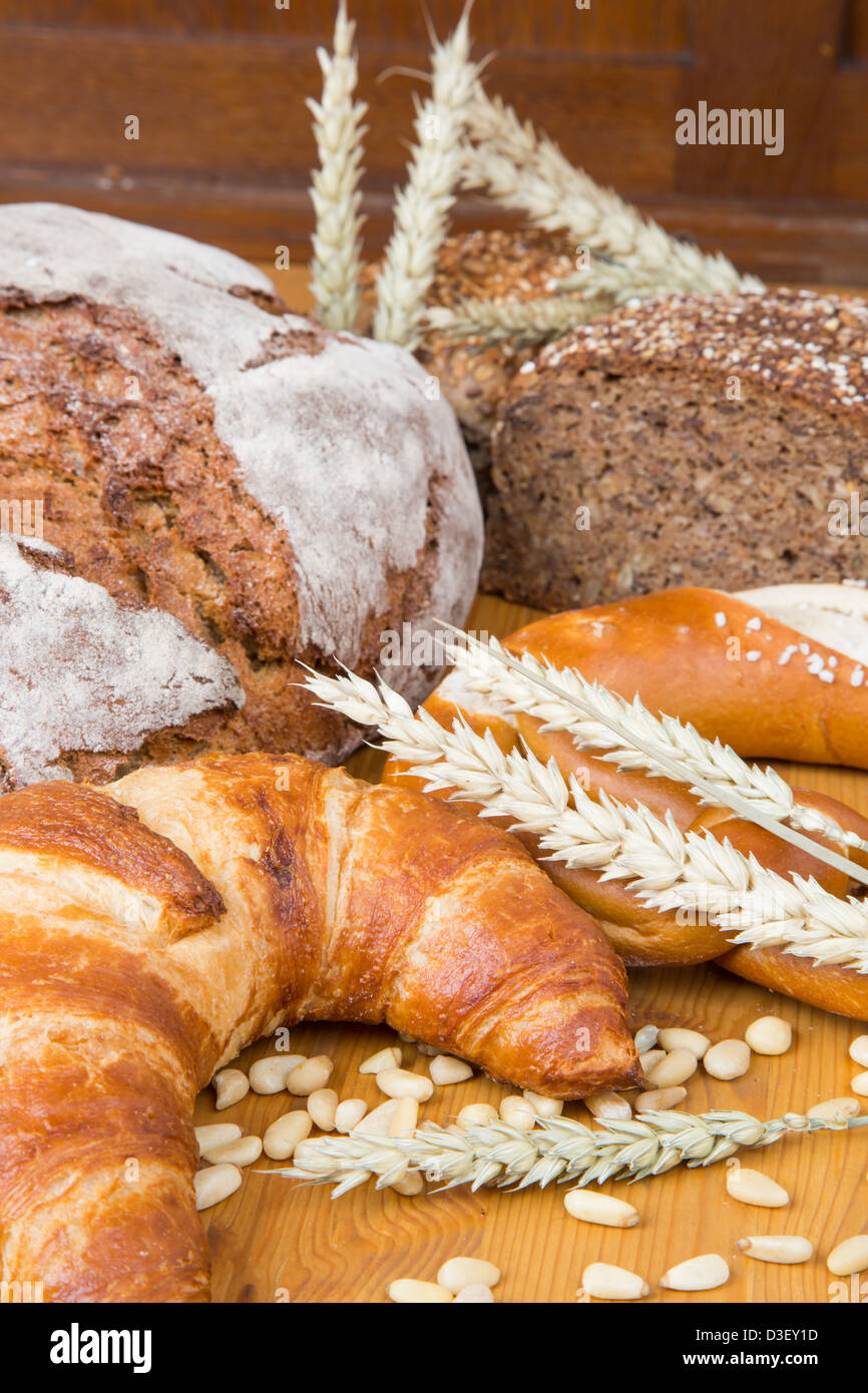 Different types of bakery products such a a loarf of bread, pretzel