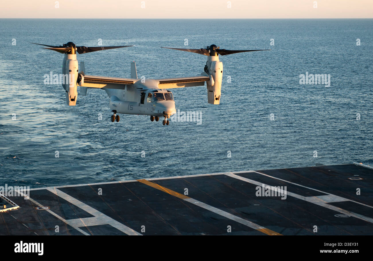 US Marine Corps MV-22 Osprey performs touch and go practice on the US Navy Nimitz class super carrier USS Carl Vinson flight deck underway February 16, 2013 in the Pacific Ocean. Stock Photo