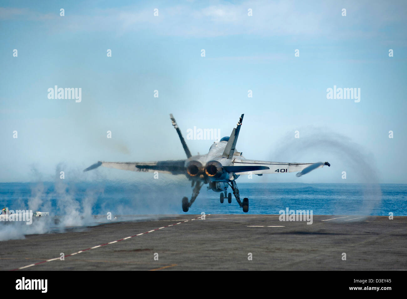 US Navy F/A-18C Hornet takes off from the US Navy Nimitz class super carrier USS Carl Vinson flight deck underway February 17, 2013 in the Pacific Ocean. Stock Photo