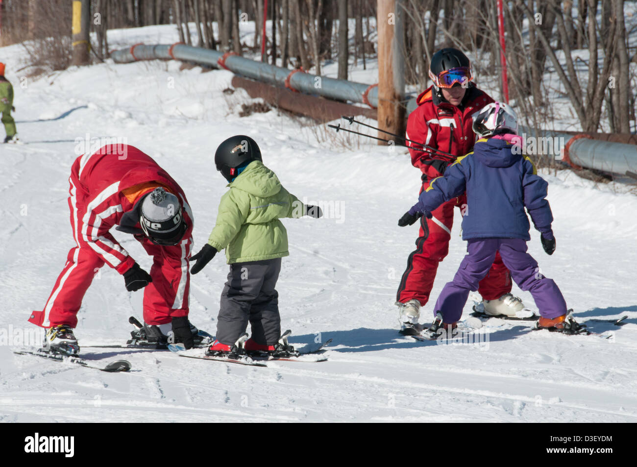 First Ski lesson of Alix, a three years old from Montreal who came with his parents for his first  private ski lesson The Ski Saint Bruno station open since 1965 has had 500 000 students graduating from its ski school. Stock Photo