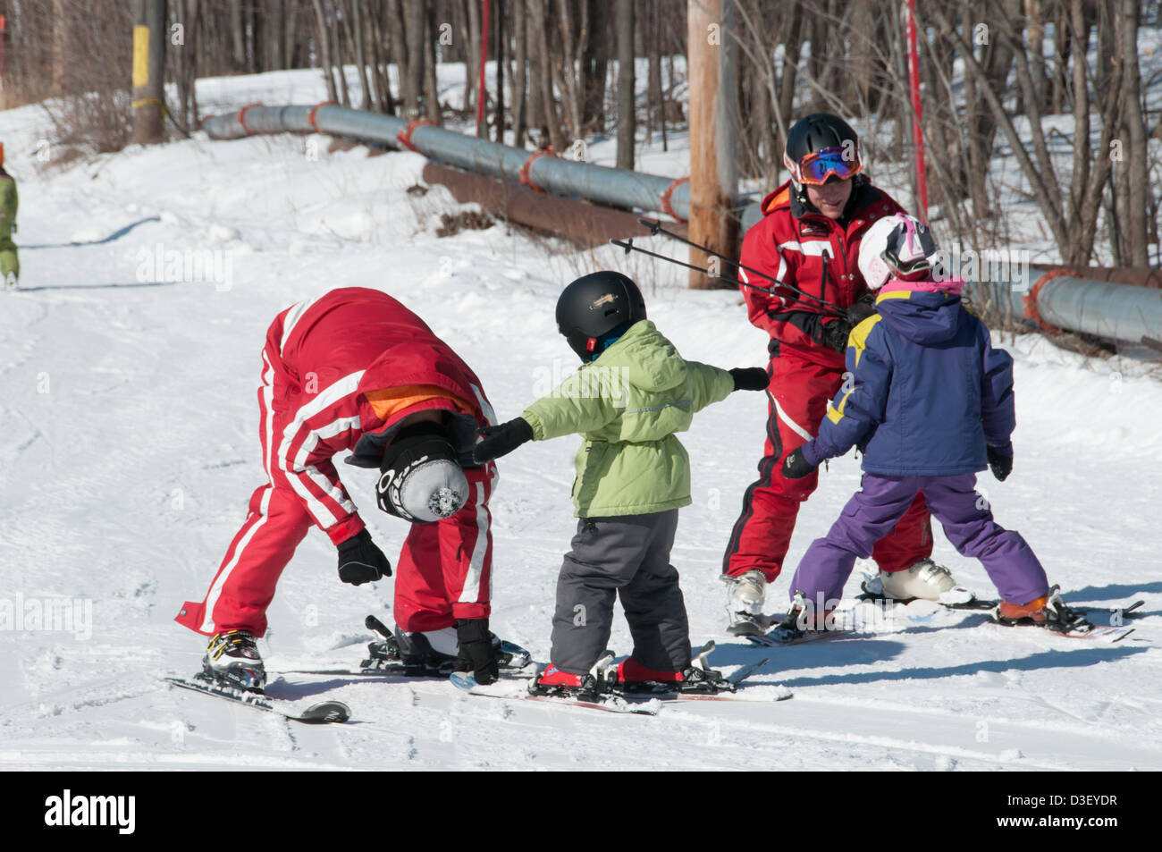 First Ski lesson of children from Montreal who came with his parents for his first  private ski lesson The Ski Saint Bruno station open since 1965 has had 500 000 students graduating from its ski school. Stock Photo