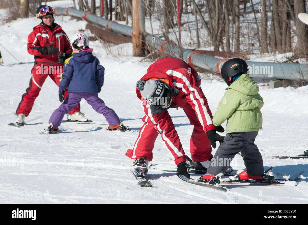 First Ski lesson of Alix, a three years old from Montreal who came with his parents for his first  private ski lesson The Ski Saint Bruno station open since 1965 has had 500 000 students graduating from its ski school. Stock Photo