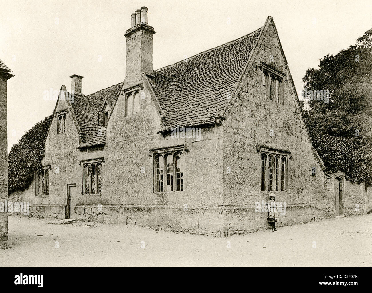 A collotype plate entitled ' The School House, Bampton, Oxon.' scanned at high resolution from a book published in 1905. Stock Photo