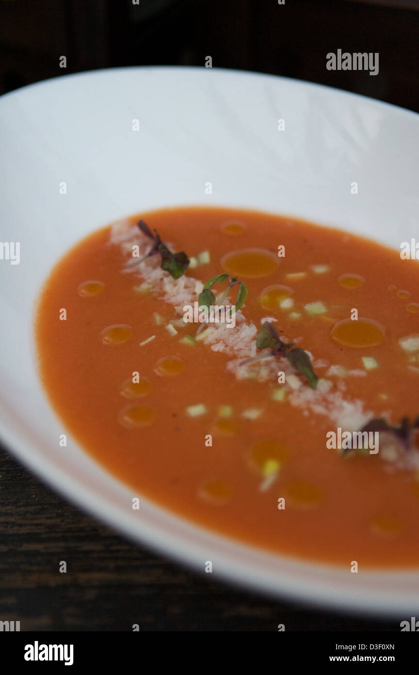 Tomato Gazpacho served with crushed breadcrumbs, cucumber & purple shiso Stock Photo