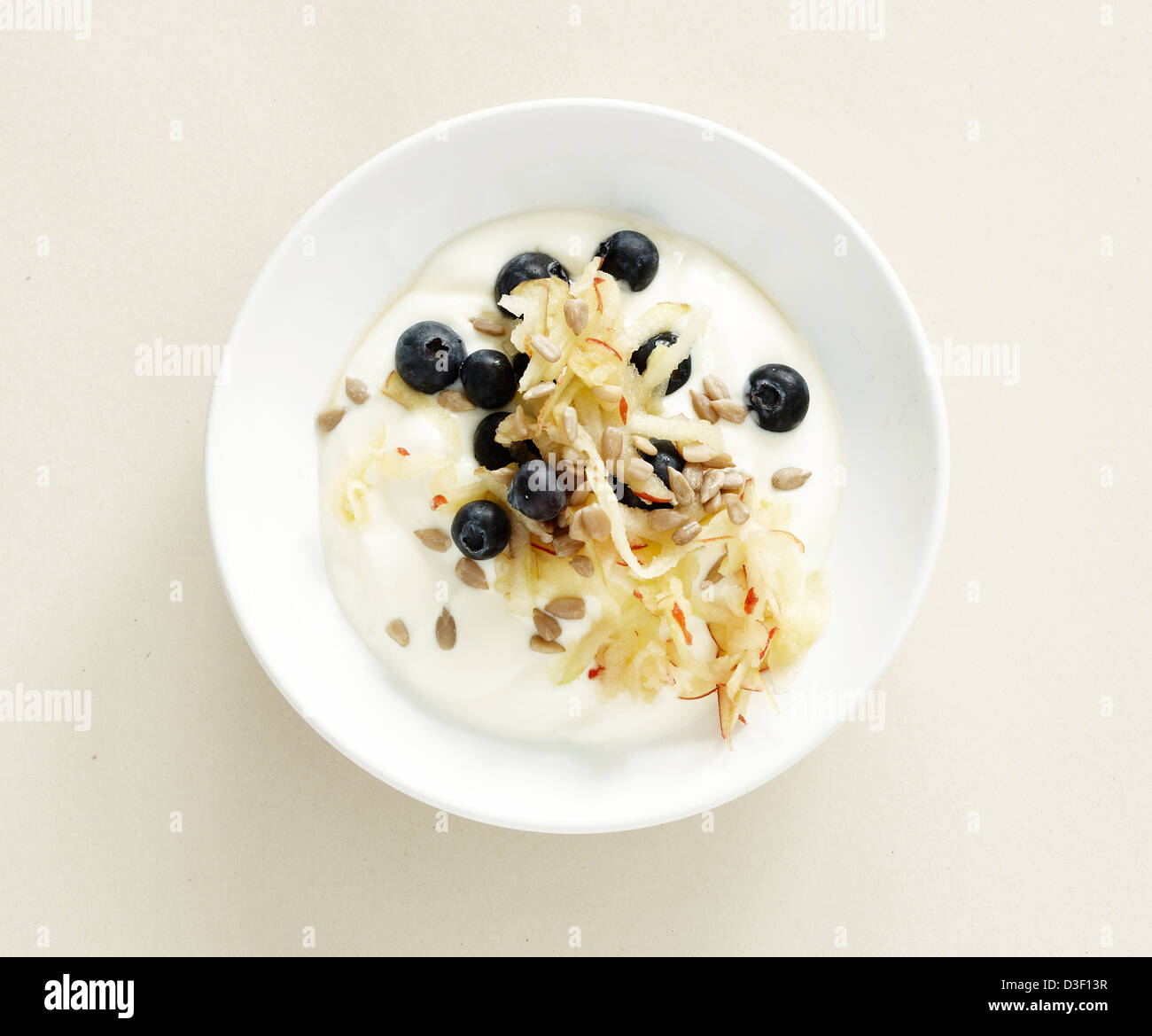 Yogurt apple blueberries sunflower seeds Stock Photo