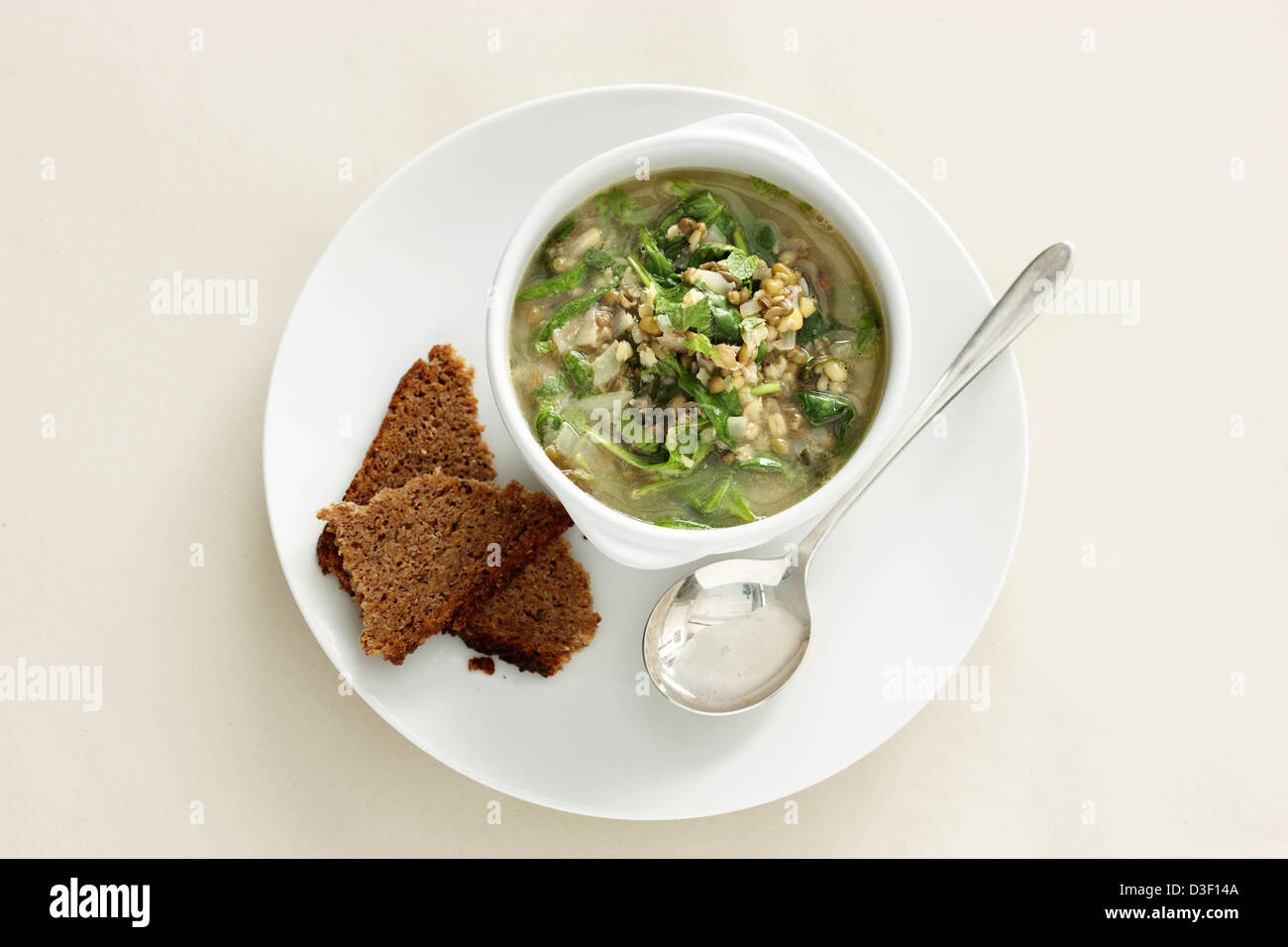 Mung bean spinach soup brown bread Stock Photo