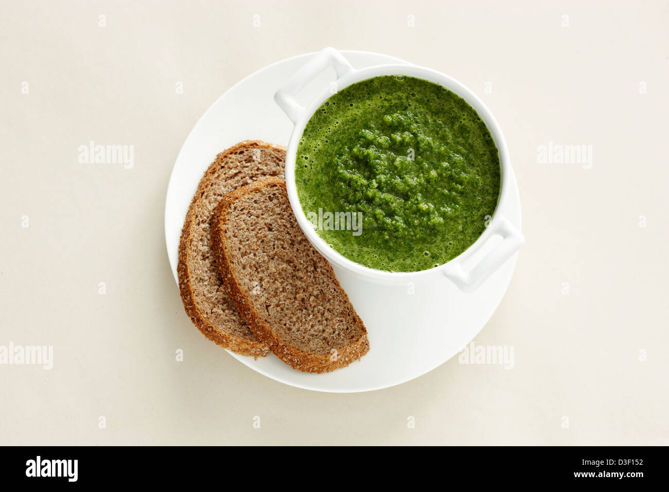 Mung bean spinach soup brown bread Stock Photo