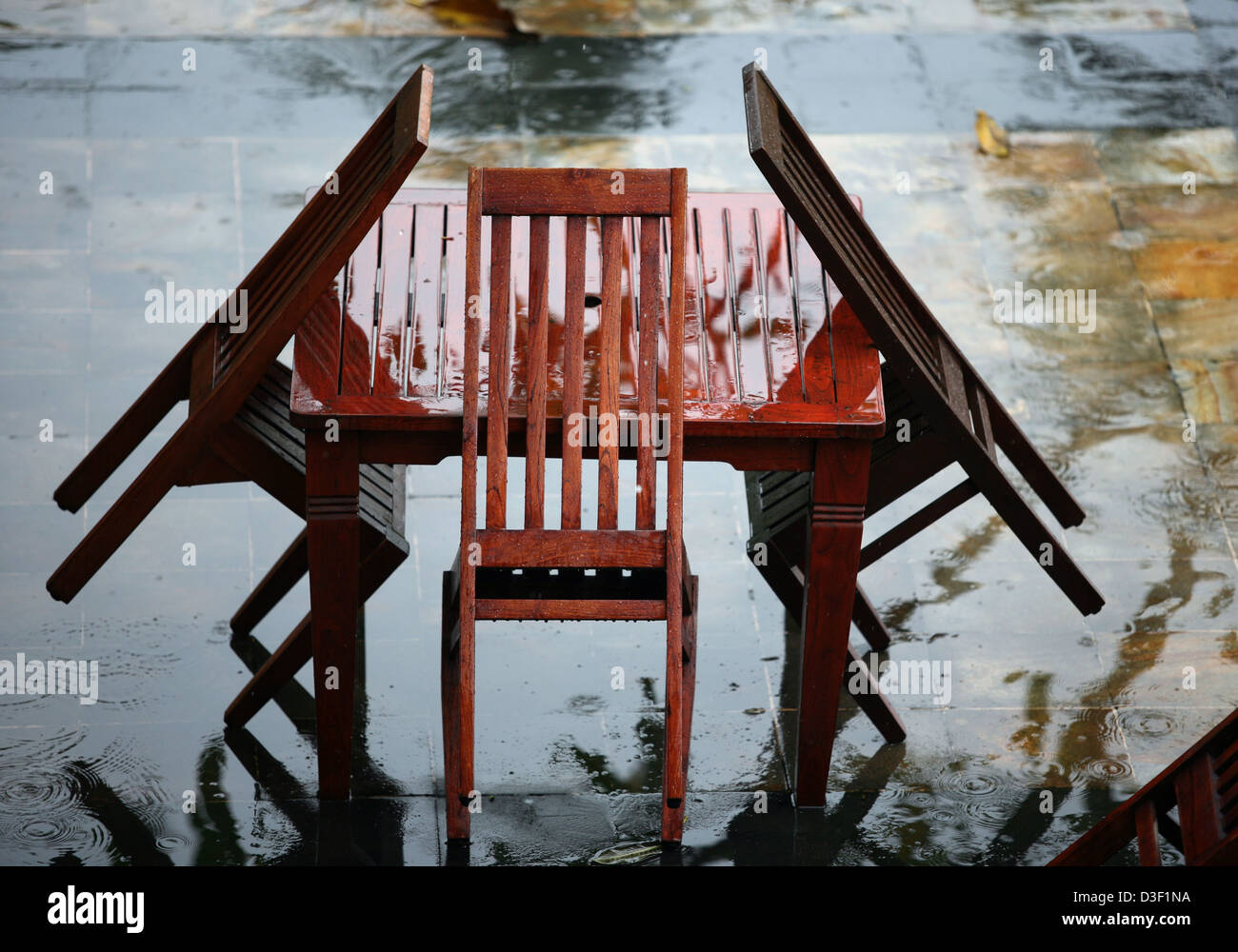 Table and chairs wet from a rain Stock Photo Alamy
