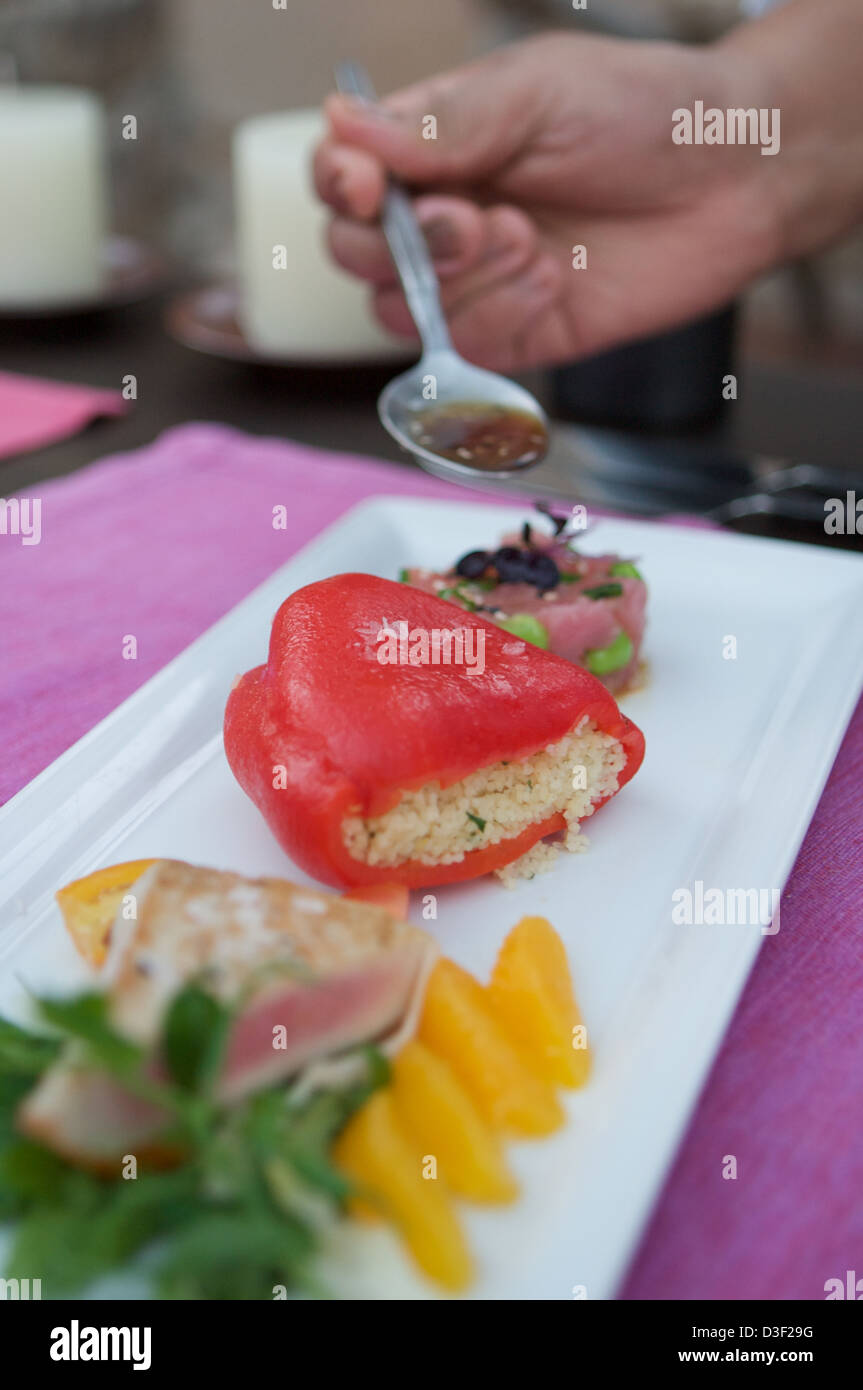 Seared sesame tuna with orange garnish, served with a tuna tartar