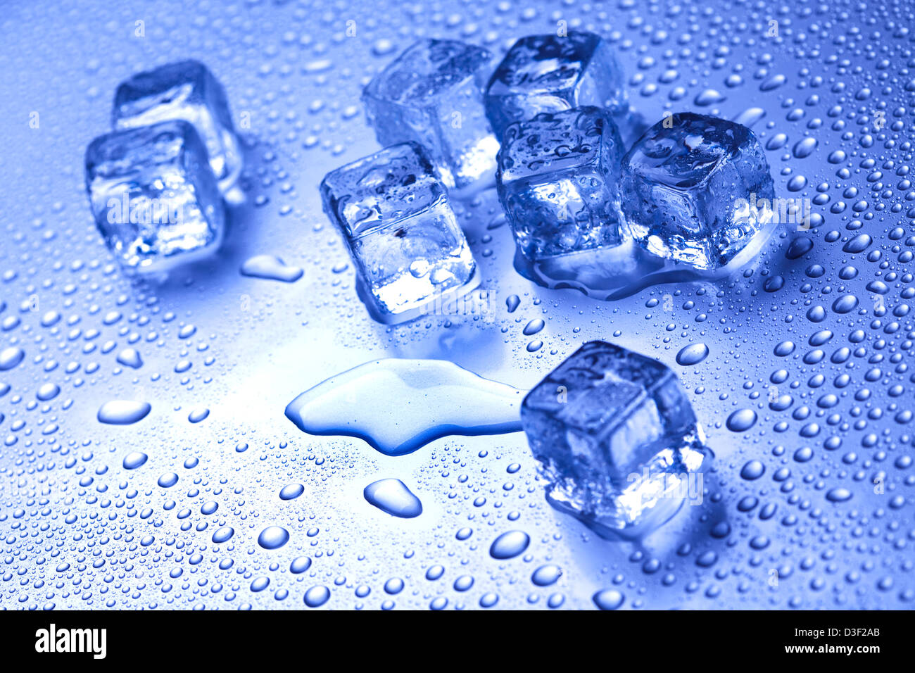 Blue background and ice cubes Stock Photo - Alamy