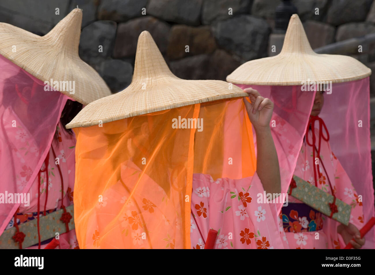 Three maidens wearing traditional kimono, wide-rimmed straw hats and silky veils during the Odawara Hojo Godai Matsuri festival Stock Photo