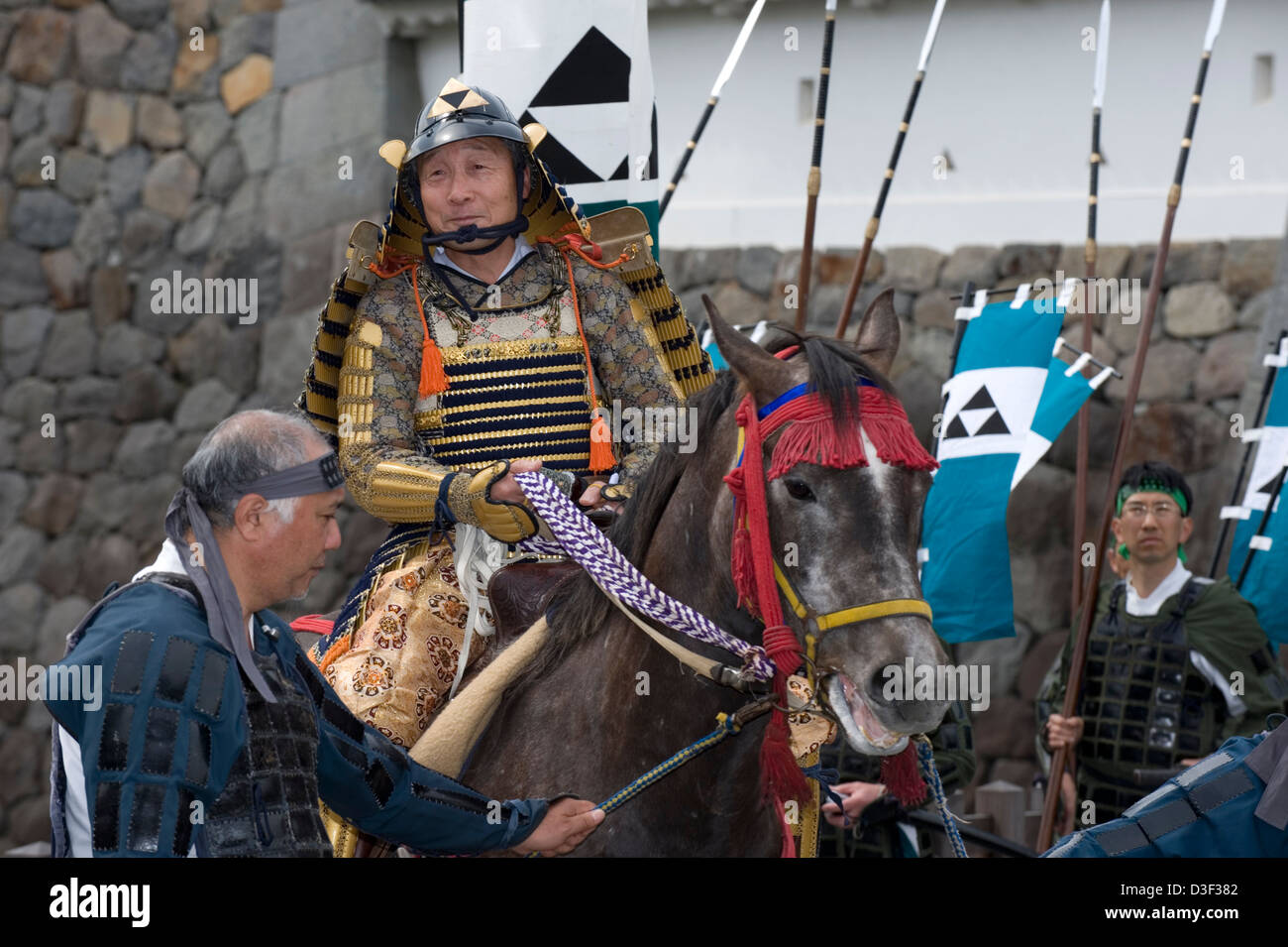 Samurai warrior on horseback wearing traditional armor at annual Odawara Hojo Godai Matsuri festival at Odawara Castle in Japan Stock Photo