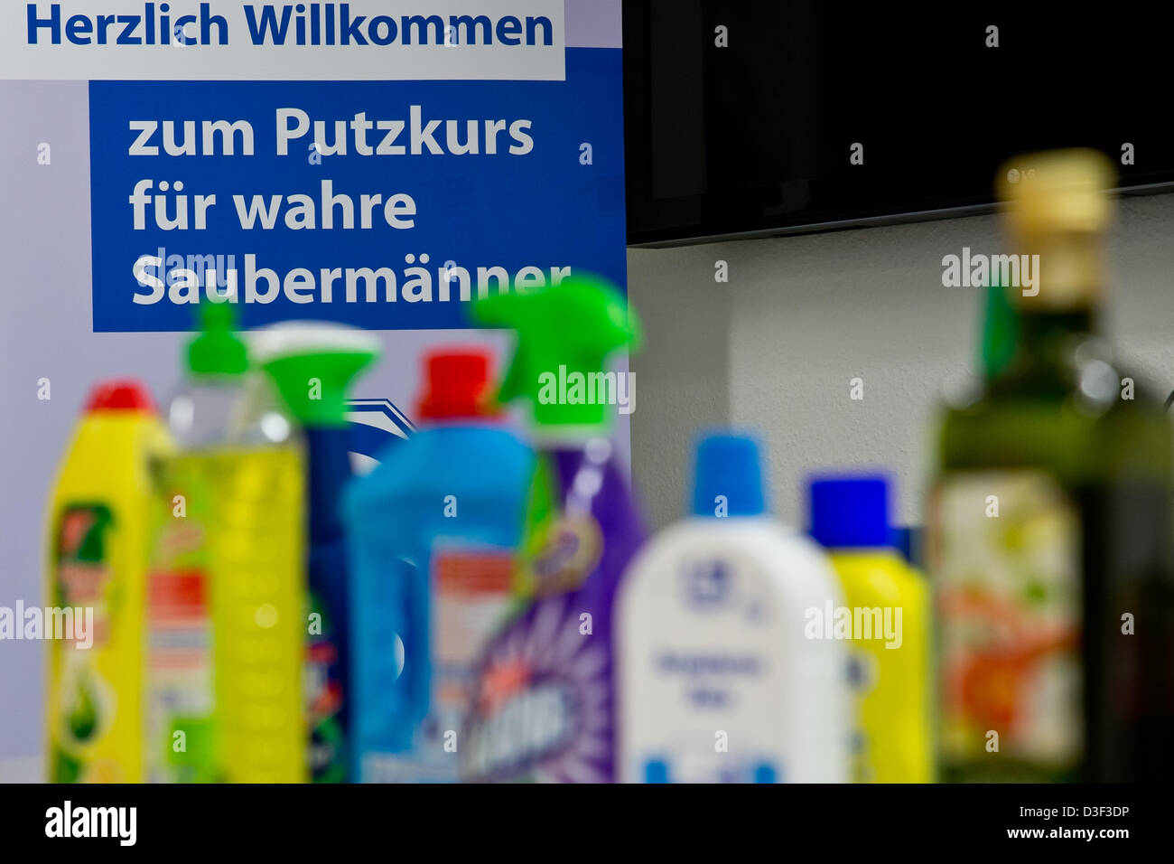 Different brands of cleaning agents are on display on a table in