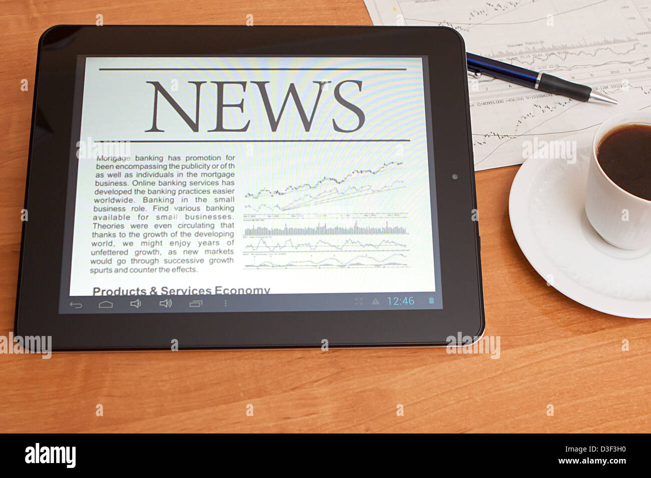 Tablet PC shows latest news on screen, which lying on work place Stock ...