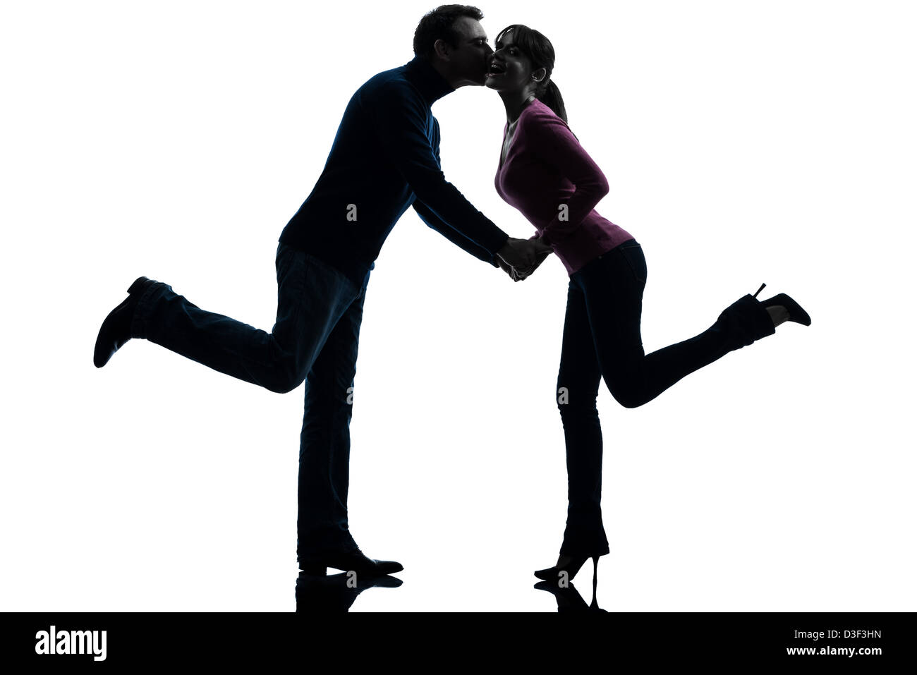 one couple woman man lovers kissing in silhouette studio isolated on ...