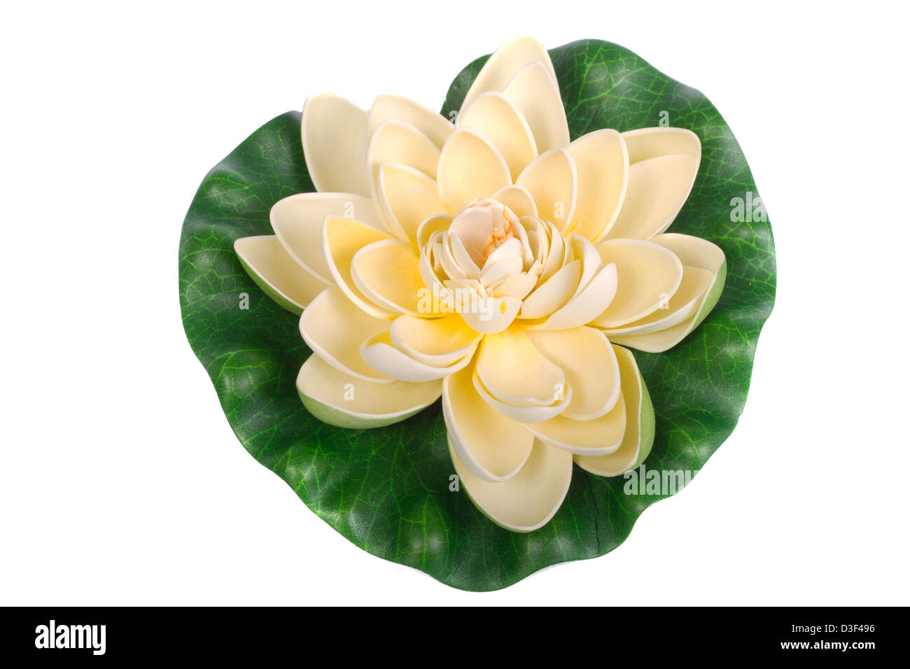 Close up view of a fake water lily flower isolated on a white