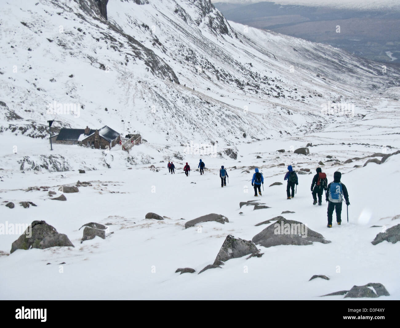 A team of Mountaineers return to the Charles Inglis Clark (C.I.C.) Hut in winter on the north face of Ben Nevis Scotland Stock Photo