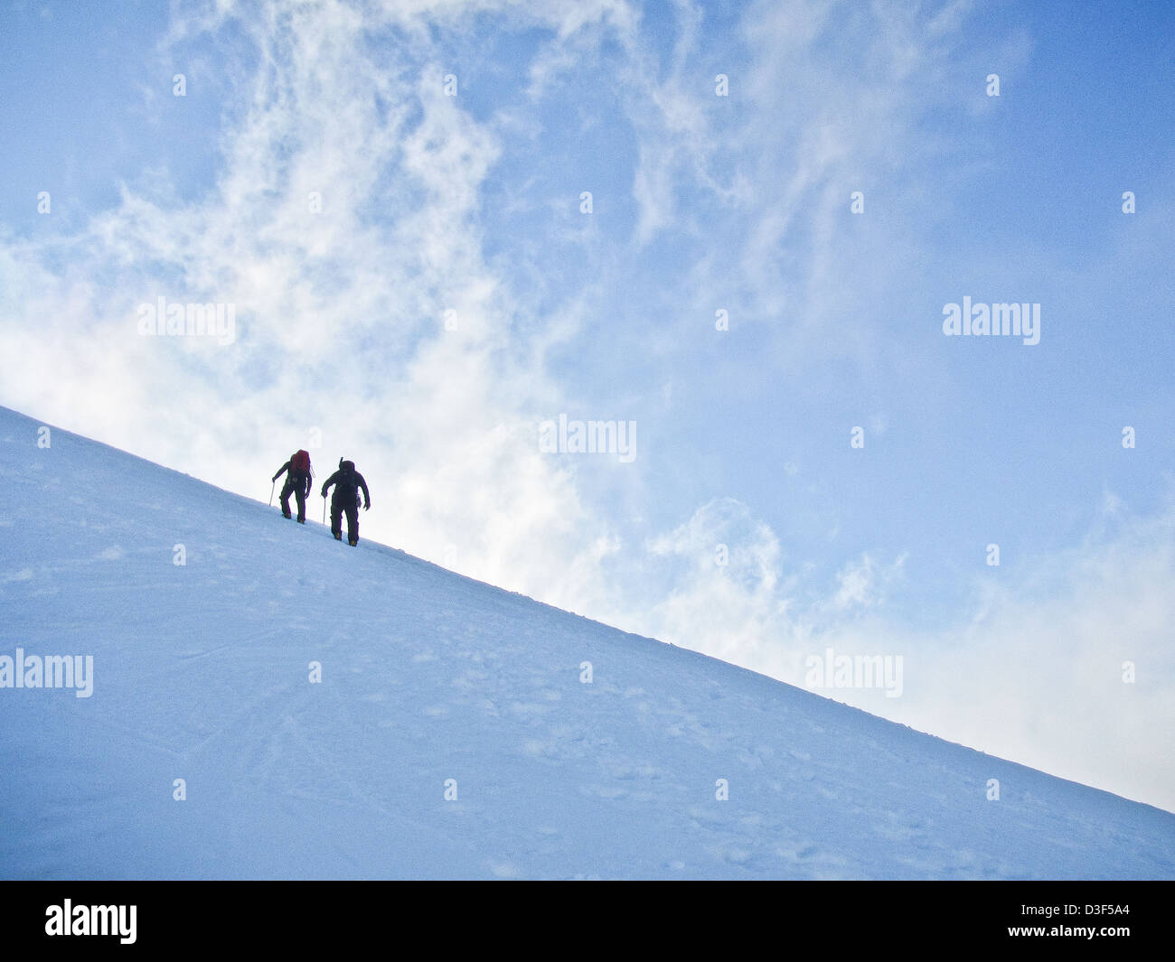 Two mountaineers on a snow slope in Scotland in Winter Stock Photo