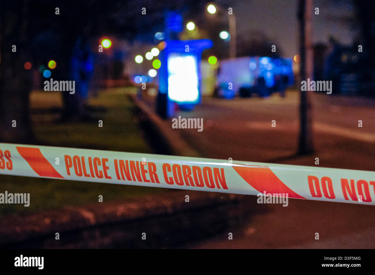 Police tape is stretched around a cordoned off area during a security alert in Northern Ireland Stock Photo