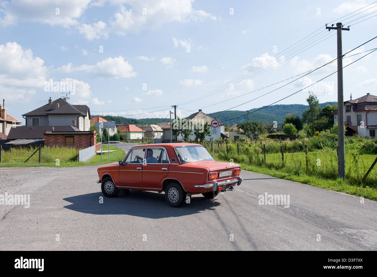 Tachty, Slovakia, a red Lada bends around a curve Stock Photo