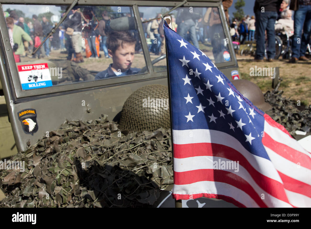Boy sitting in a military Jeep during the Operation Marget Garden Memorial in Ede, The Netherlands Stock Photo