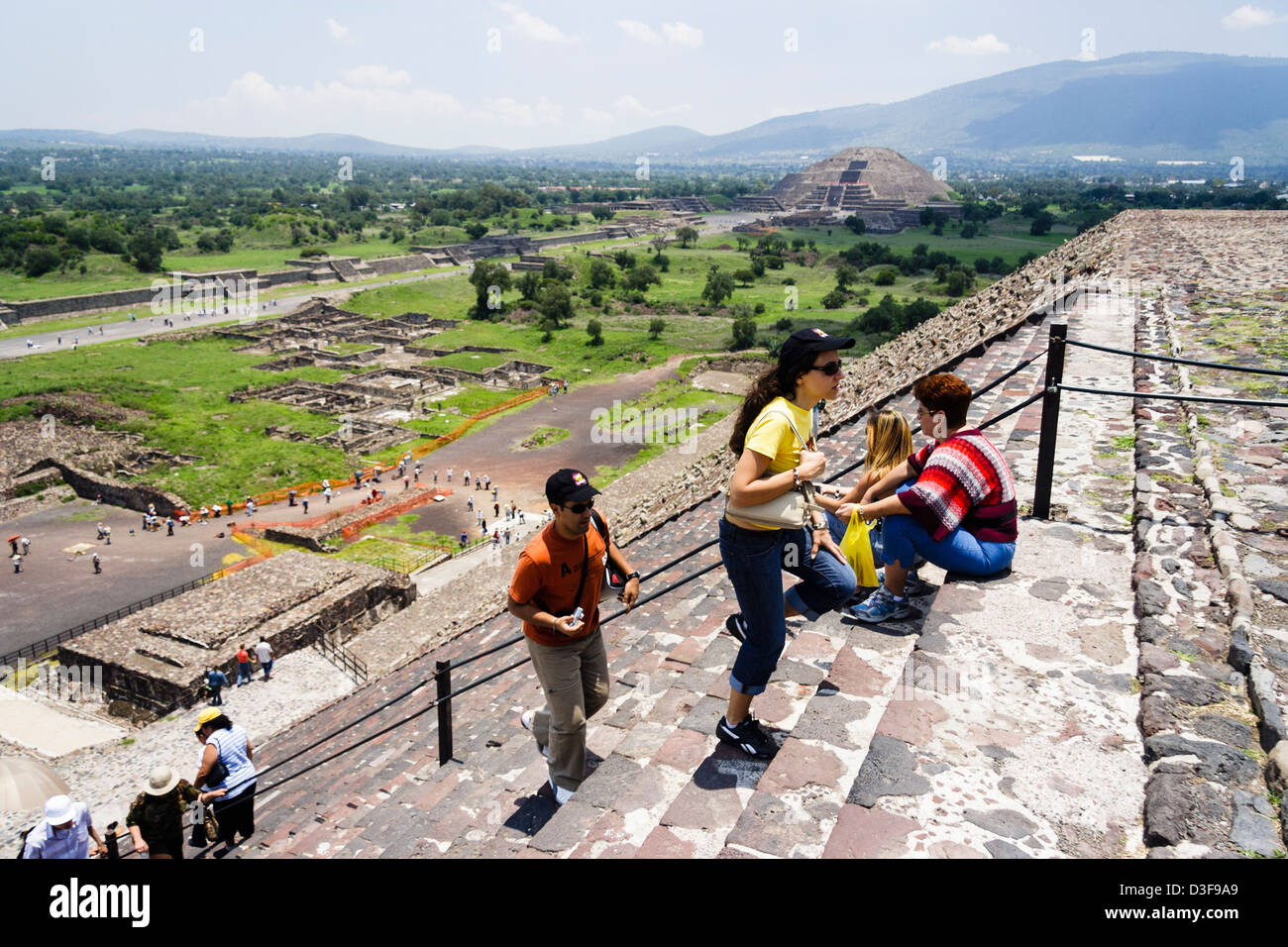 Tourists climbing the Pyramid of the Sun with the Avenue of the Dead