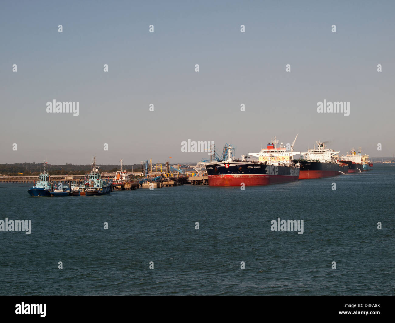 Line of oil tankers berthed at the Esso Fawley oil refinery Hampshire England UK Stock Photo