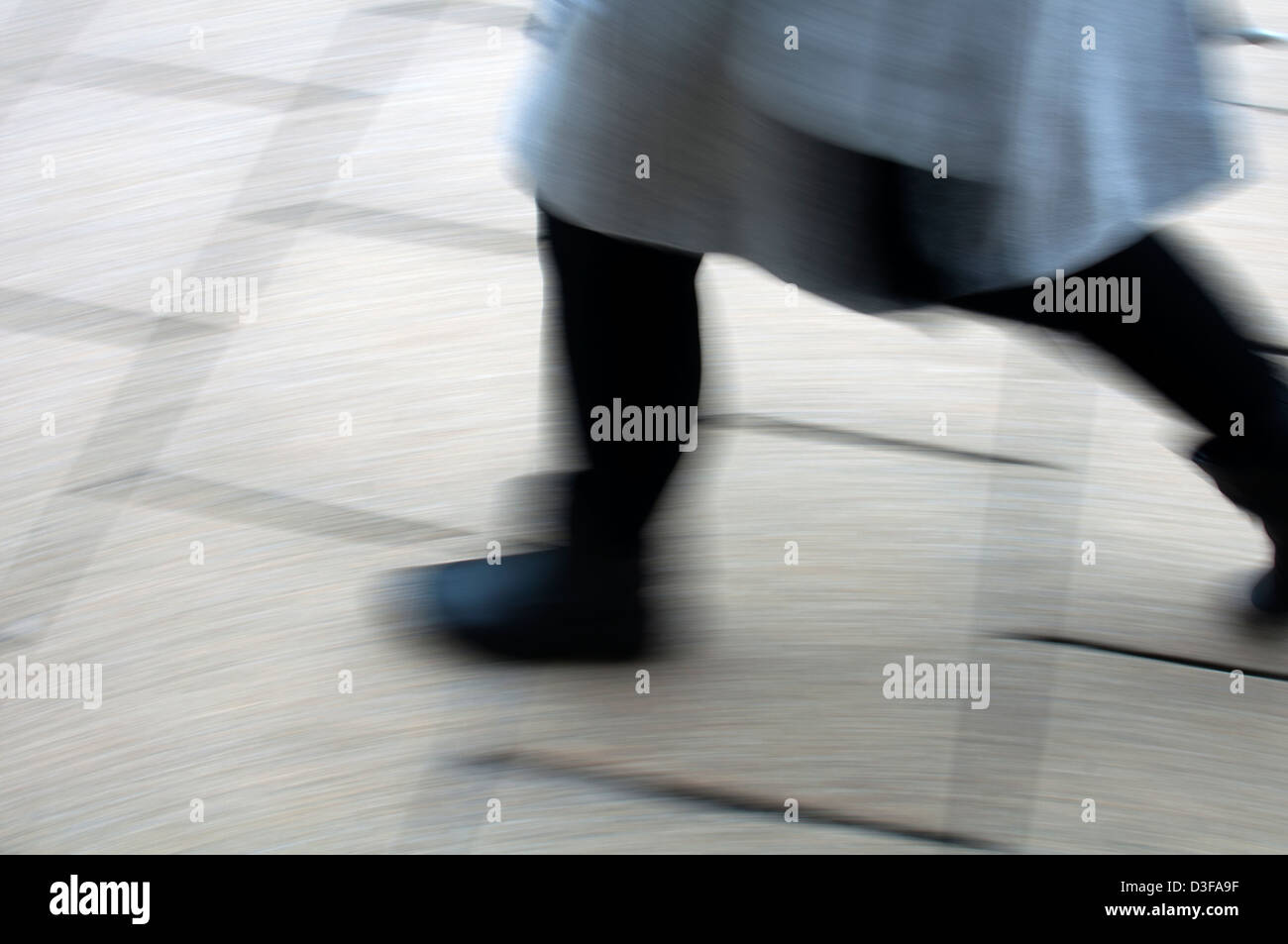 Woman walking, blurred Stock Photo