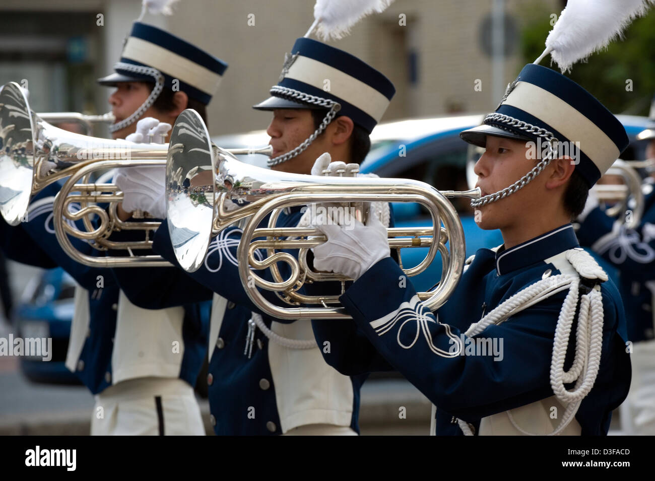 Tuba players in full costume performing in a Westernstyle marching