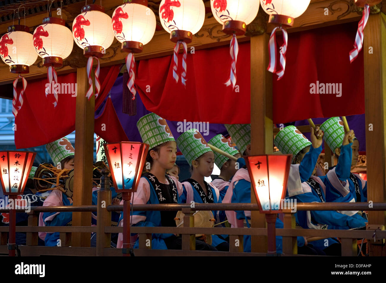 Young girl drummers inside a lantern festooned traditional float at Gotenyatai Hikimawashi Festival in Hamamatsu, Shizuoka. Stock Photo