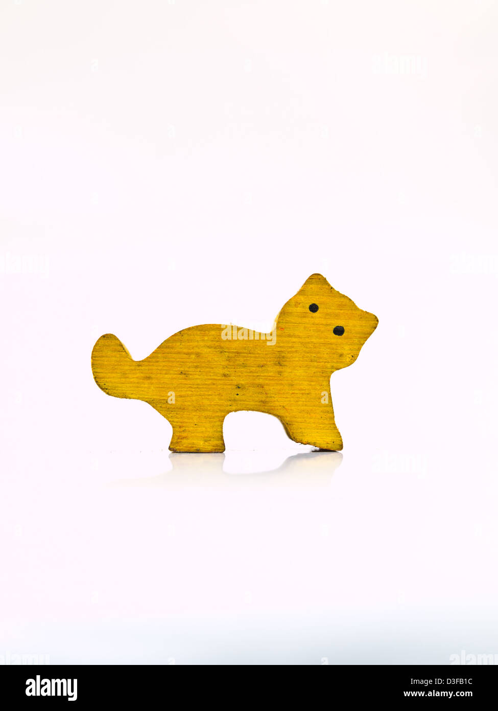 A yellow wooden cat isolated on white Stock Photo - Alamy