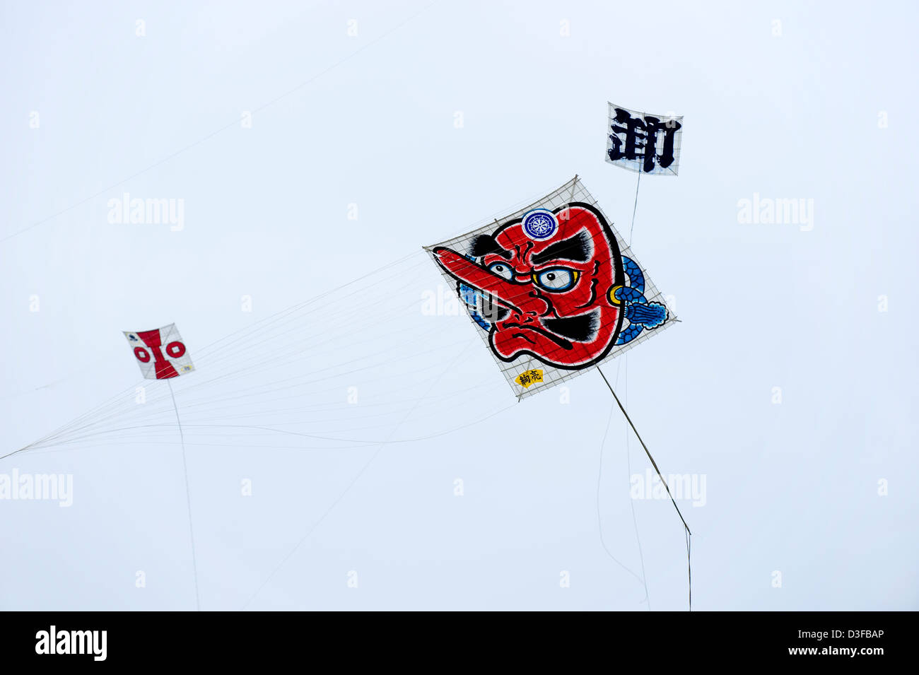 Colorful traditional paper and bamboo kites soar in wind at Hamamatsu