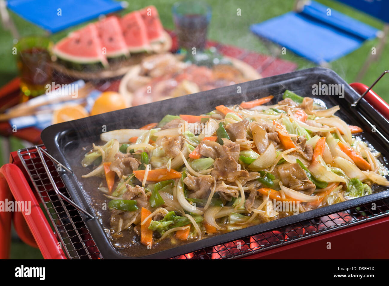 Pork and Vegetable StirFry Cooked on Barbecue Grill Stock Photo Alamy