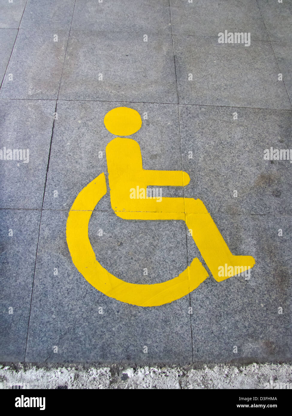 Yellow handicapped sign of floor tile Stock Photo