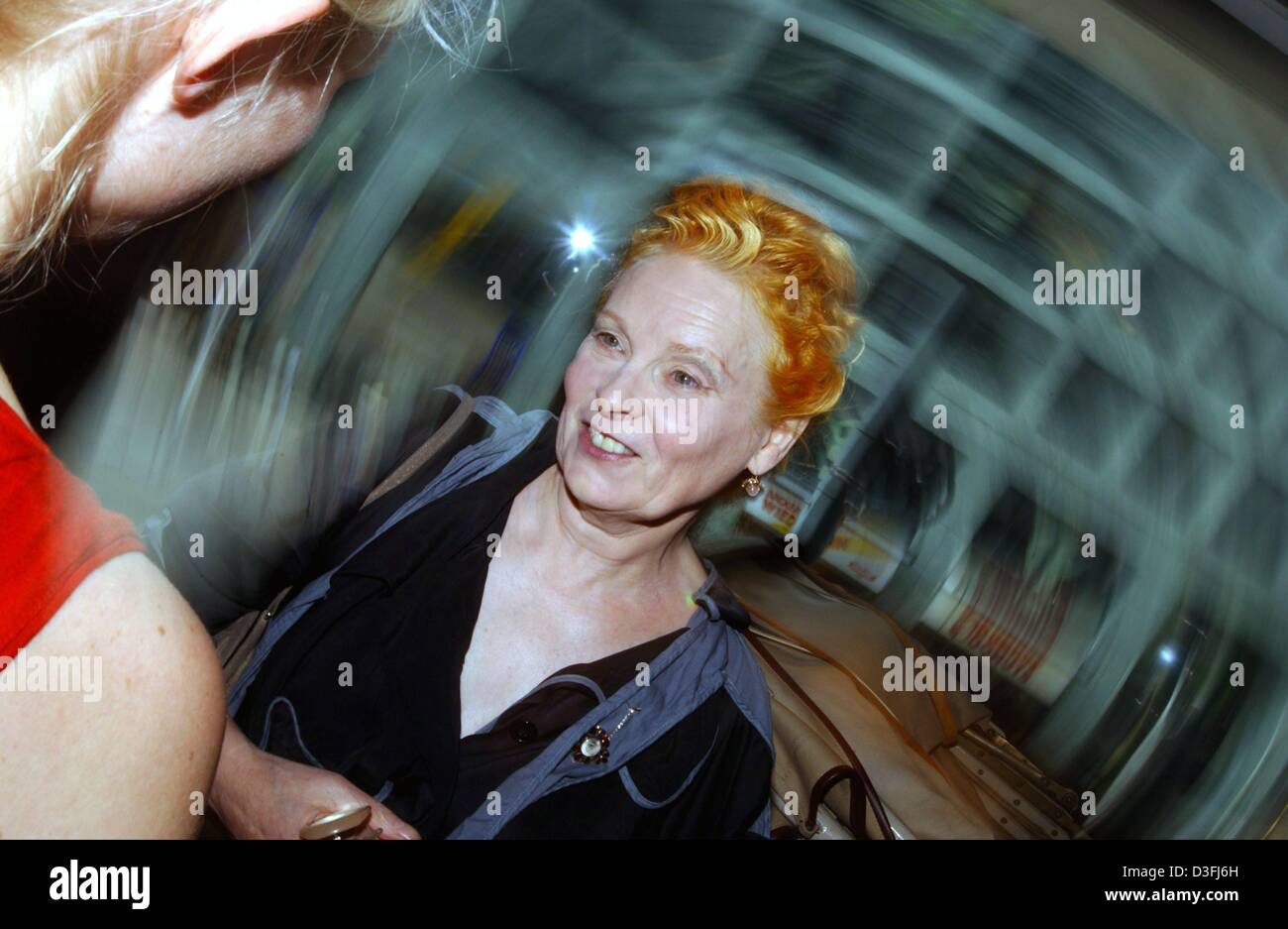 (dpa) Star designer Vivienne Westwood (2nd from L), smiles during the