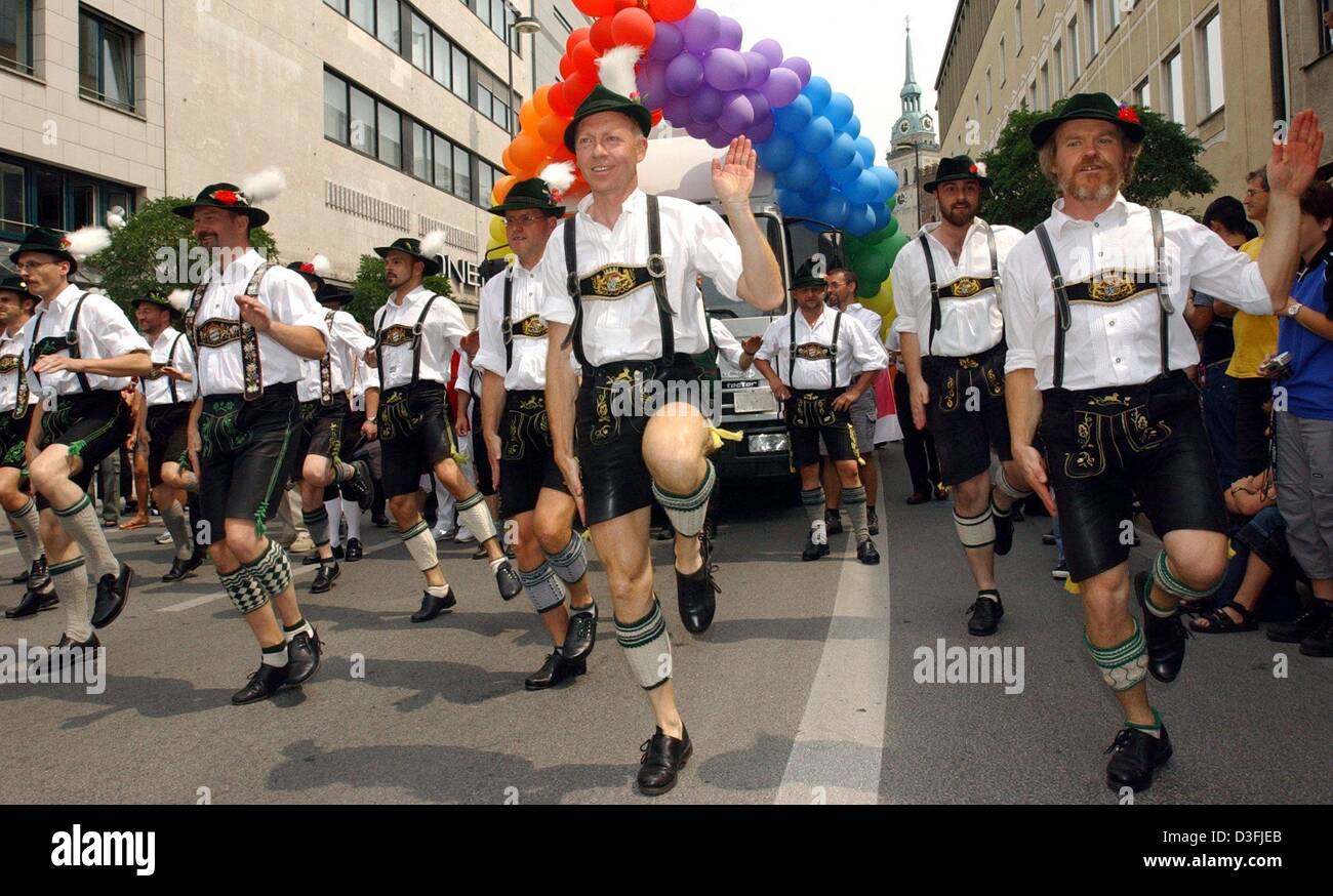 (dpa) - A group of gay 'Schuhplattler' perform a traditional Bavarian volk dance at the Christopher Street Day (CSD) in the streets of Munich, Germany, 12 July 2003. About 15,000 gays and lesbians celebrated the CSD every year reminding of the police fighting against homosexual clubs in New York in 1969. Stock Photo