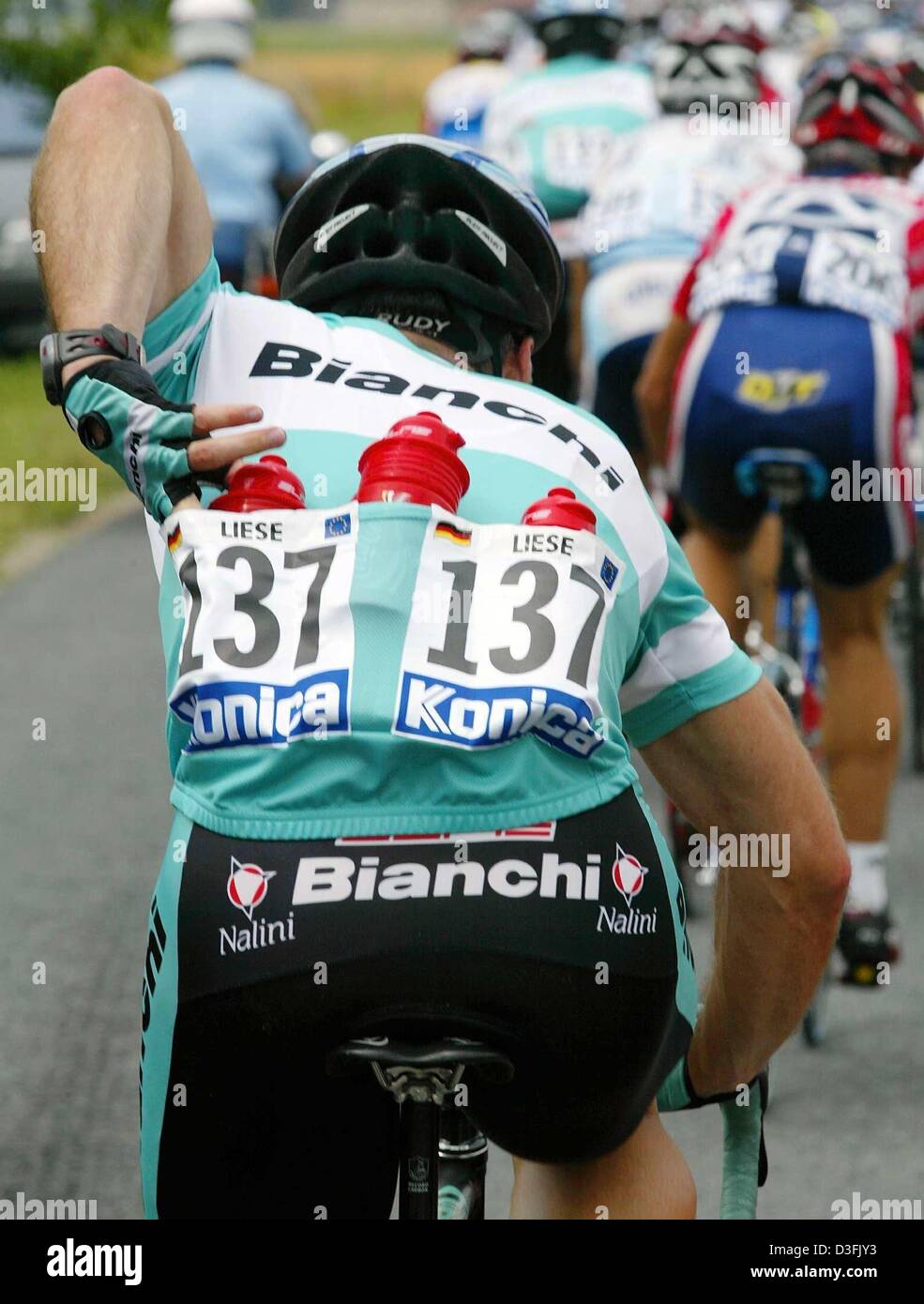 (dpa) - Germany's Thomas Liese is the waterboy of the team Bianchi during his first Tour de France, in Meaux near Paris, 6 July 2003. The job of the water boy is to get the bottles from the supply truck and to bring them to his teammates in the cyclists pack. Stock Photo