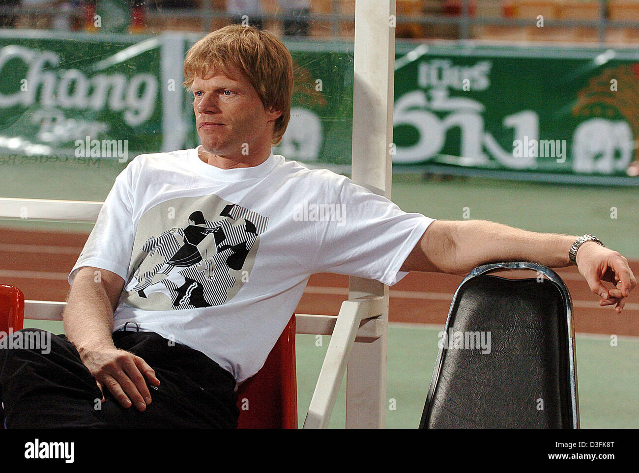 (dpa) - German goalkeeper Oliver Kahn sits on the substitute bench during the international friendly between Thailand and Germany at Rajamangala National Stadium in Bangkok, Thailand, Tuesday 21 December 2004. Germany won by a final score of 5-1. Stock Photo