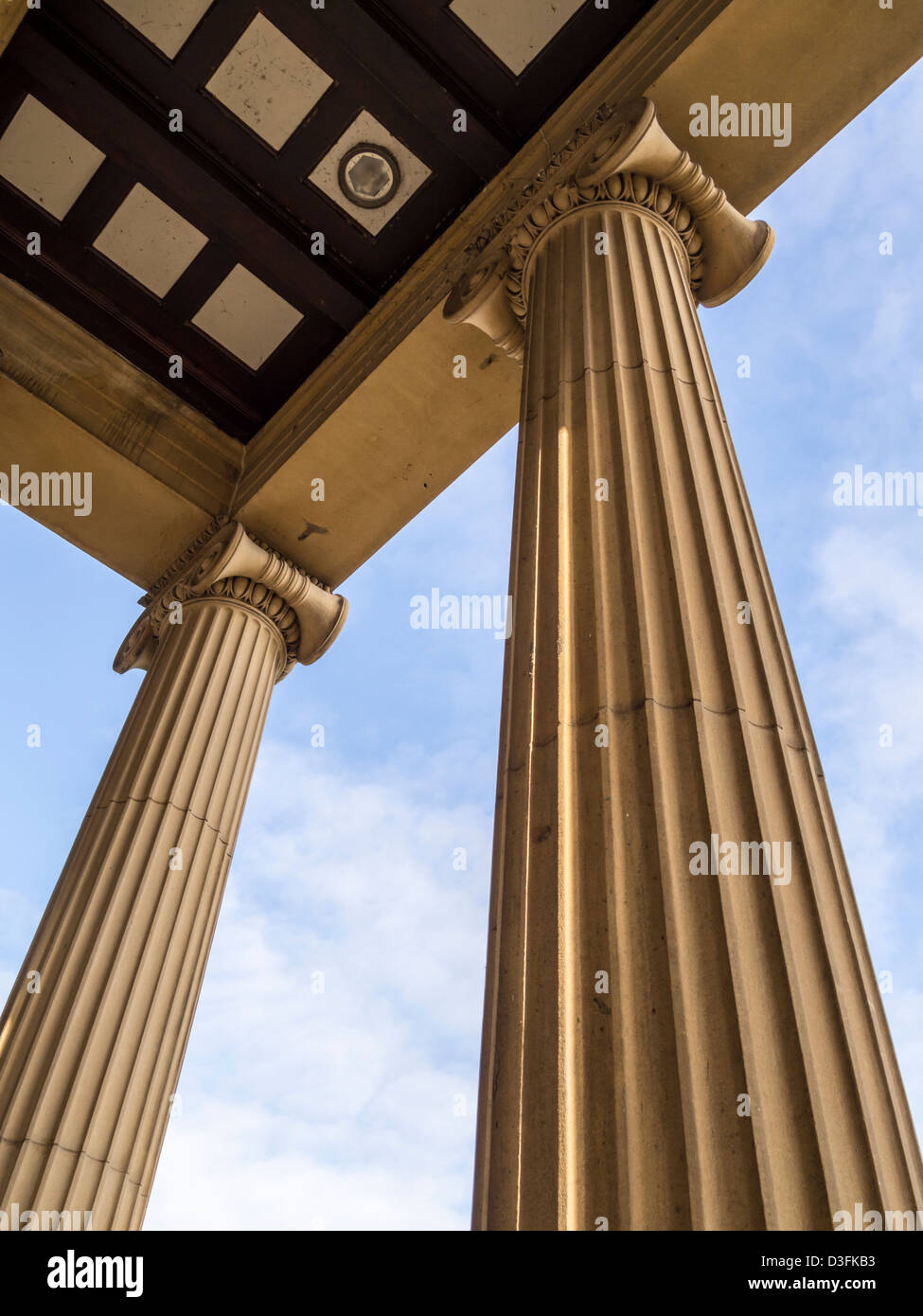 Stone pillars holding up roof looking skyward on Weston park Museum